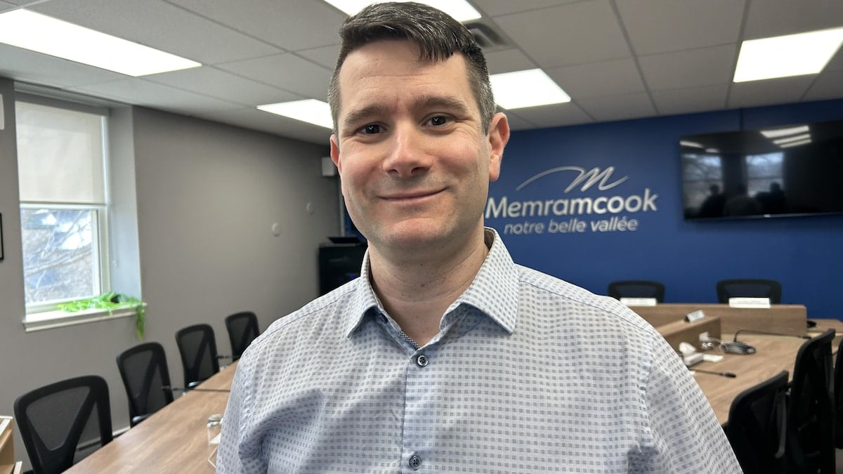 A man smiling in an office