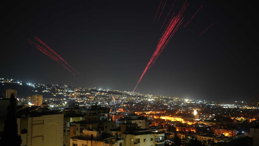 Tracer rounds illuminate the night sky as people fire live ammunition and fireworks into the air as a ceasefire was beginning between Israel and Hezbollah, in Beirut, Lebanon, in the early hours of Friday.
