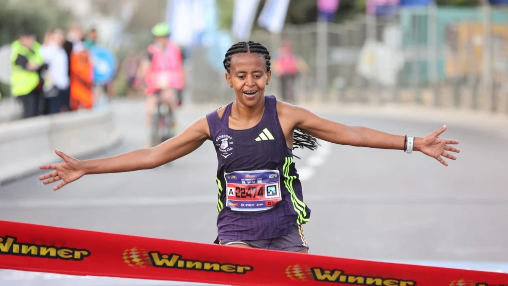 Bika Mintamer, 34, of Ramat Hasharon, finished first in the women’s race in the Jerusalem Winner Marathon in a time of 01:24:29, April 14, 2026. Credit: Sportphotography.