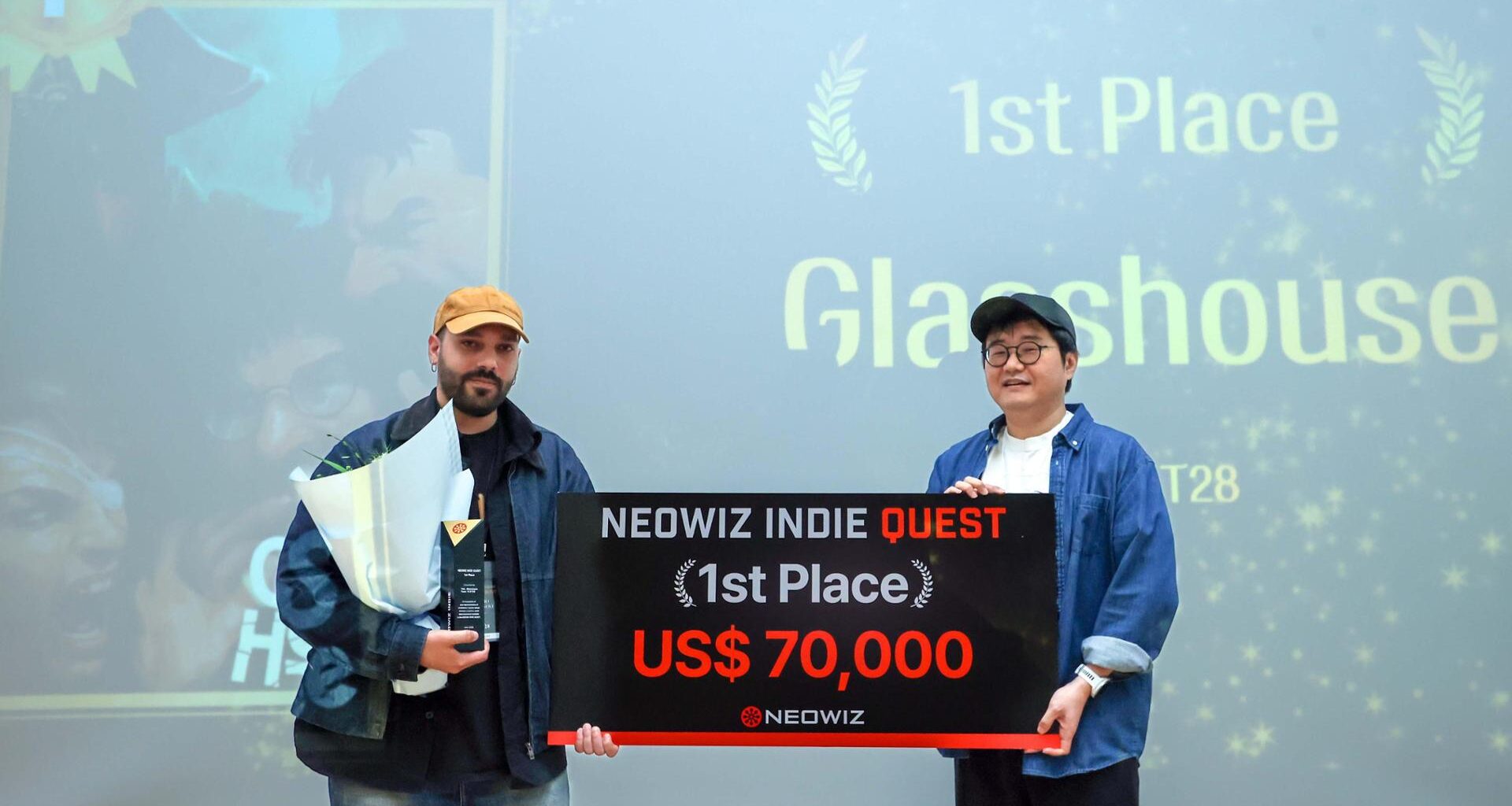 NEOWIZ co-CEO Kim Seung-chul, right, poses with Giacomo Montagnoli, developer of FLAT28