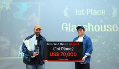 NEOWIZ co-CEO Kim Seung-chul, right, poses with Giacomo Montagnoli, developer of FLAT28