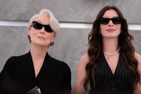 This image released by 20th Century Studios shows Meryl Streep, left, and Anne Hathaway in a scene from "The Devil Wears Prada 2." (Macall Polay/20th Century Studios via AP)