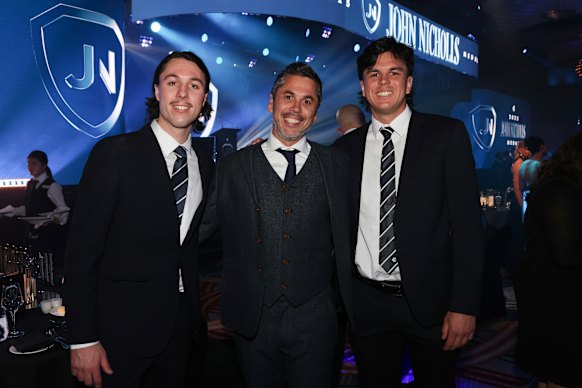 Former footballer Ben Hollands (centre) with sons Ollie (left) and Elijah (right) at the 2025 Carlton club championships.