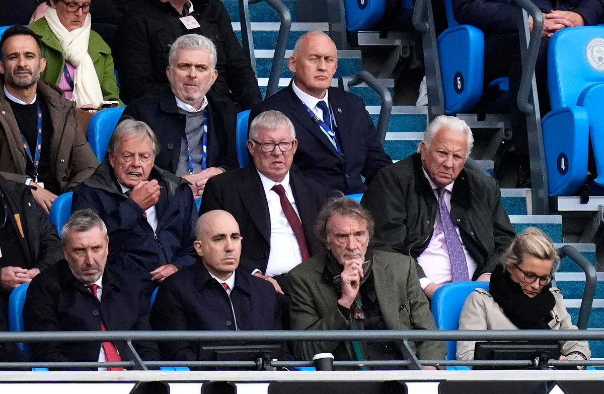 Sir Alex Ferguson, Jason Wilcox, Omar Berrada, Sir Jim Ratcliffe and Catherine Polli react in the stands during the Premier League match at Etihad Stadium, Manchester
