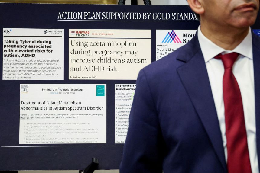 Food and Drug Administration Commissioner Dr. Marty Makary stands in front of a board displaying medical articles during the September 22 announcement from Trump.