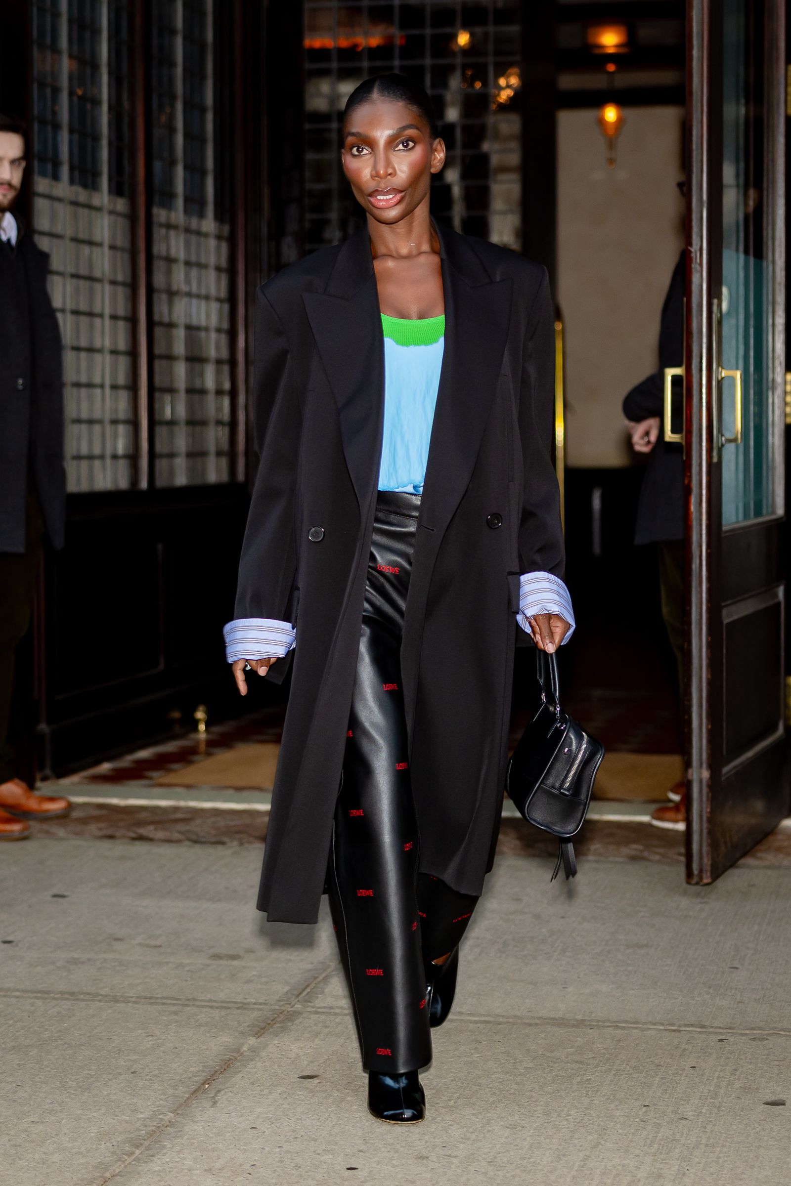 Image may contain Michaela Coel Clothing Coat Blazer Jacket Overcoat Person Formal Wear Suit and Adult