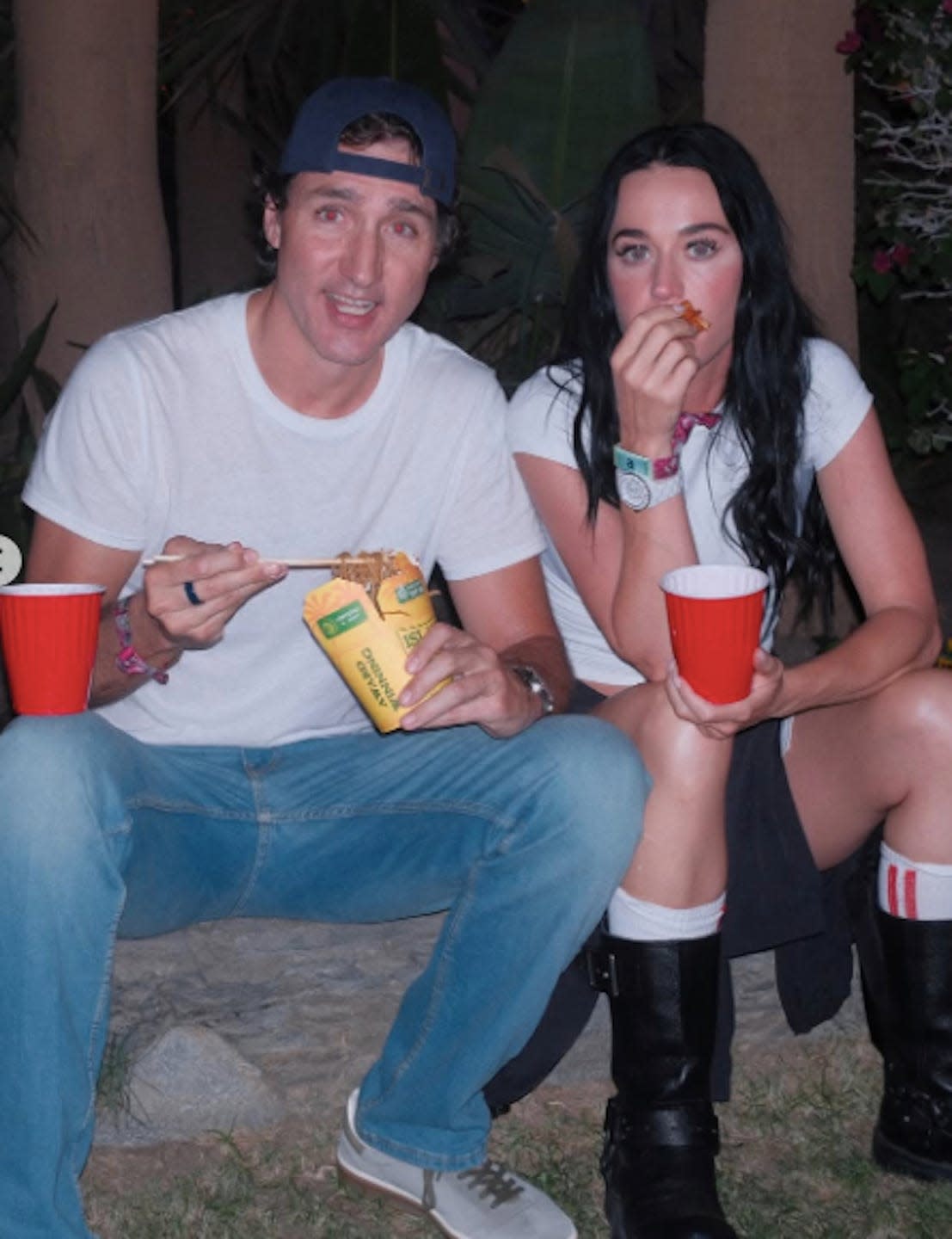 Two individuals enjoying snacks and drinks outdoors.