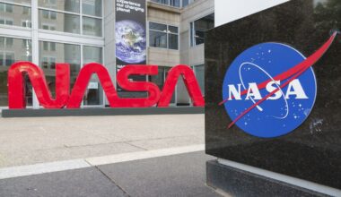 Large red letters spelling out NASA as a logo with a blue NASA icon nearby at the agency's headquarters.