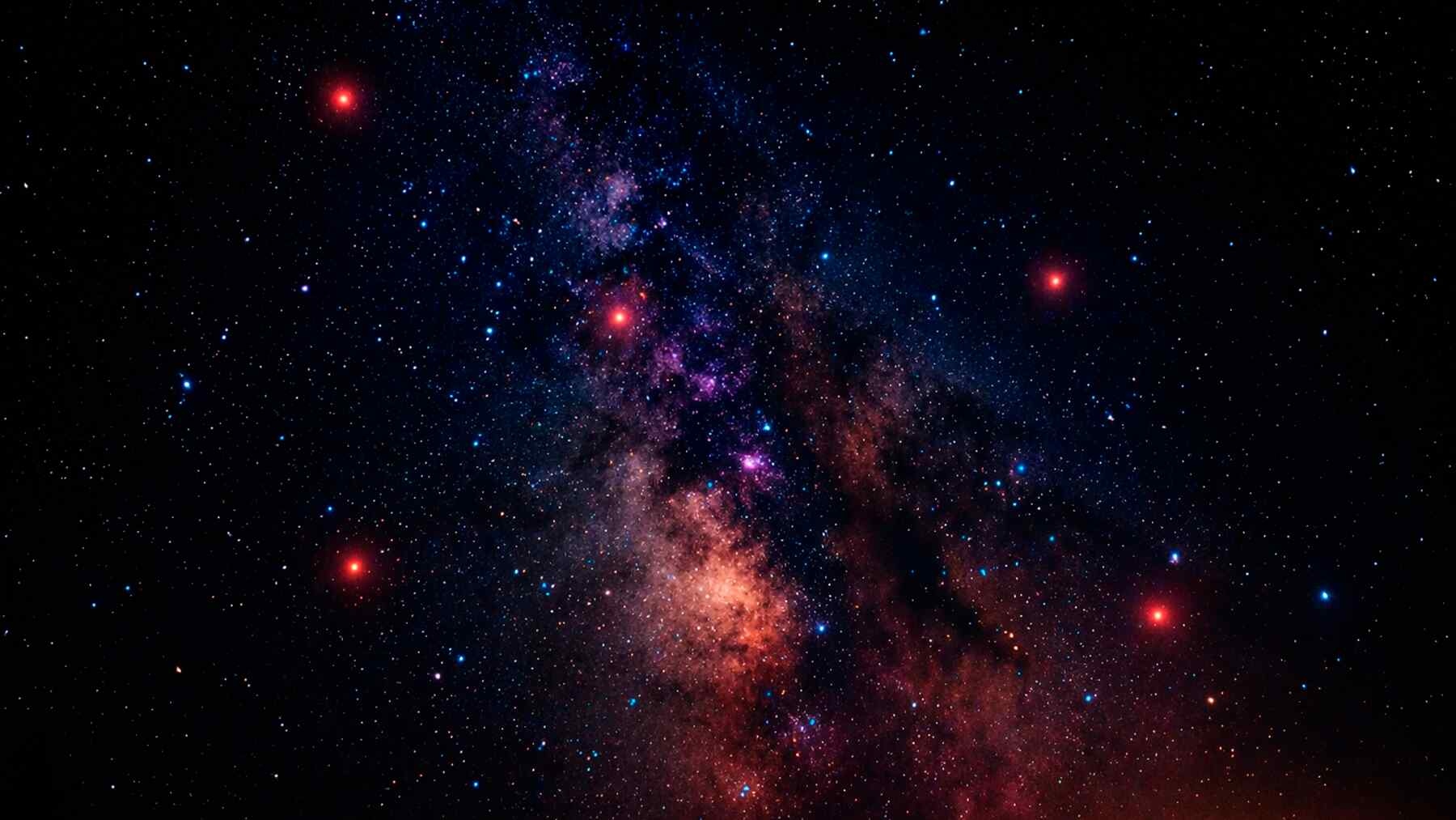 Astronomers find 340 tiny red dots