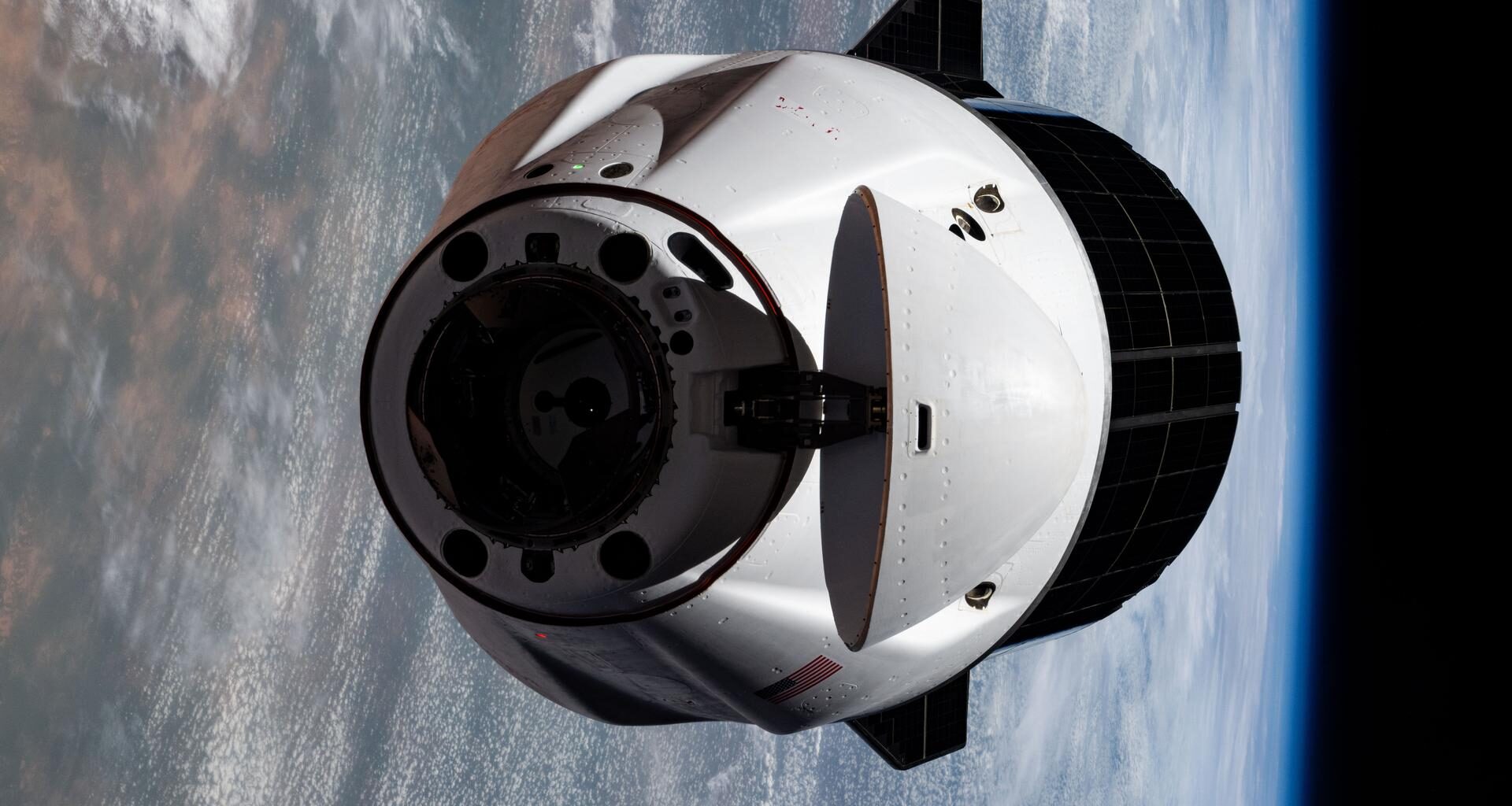 A SpaceX Dragon cargo spacecraft with its nosecone open and carrying over 5,000 pounds of science, supplies, and hardware as NASA's SpaceX CRS-33 mission approaches the International Space Station for an automated docking to the Harmony module's forward port. Both spacecraft were flying 259 miles above western Mauritania near the Atlantic coast at the time of this photograph.