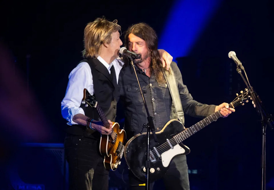 Paul McCartney puts his arm around Dave Grohl as they play together on Glastonbury's Pyramid Stage in 2022