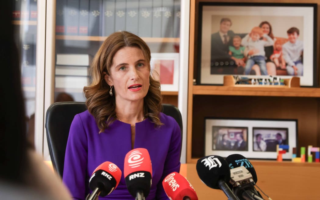 Finance Minister Nicola Willis faces questions as economic outlook downgraded.