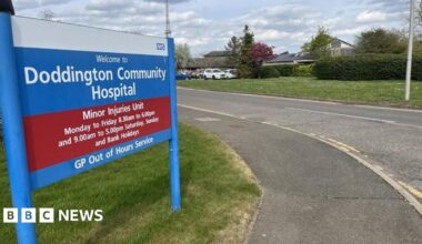 General image of the sign outside Doddington Community Hospital, which adds its opening times and that it is a minor injuries unit and GP out of hours service