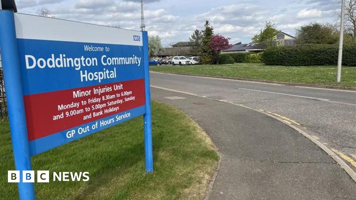 General image of the sign outside Doddington Community Hospital, which adds its opening times and that it is a minor injuries unit and GP out of hours service
