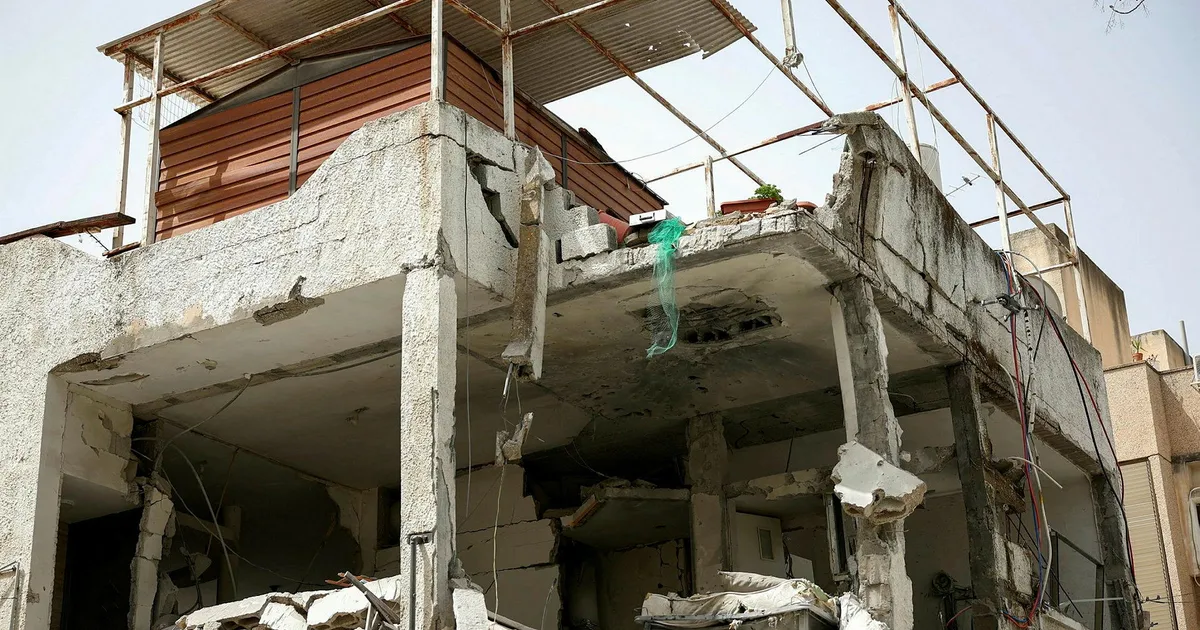 Iran fires missiles at Tel Aviv area: 5 wounded, cluster bomb hits near IDF HQ - Haaretz