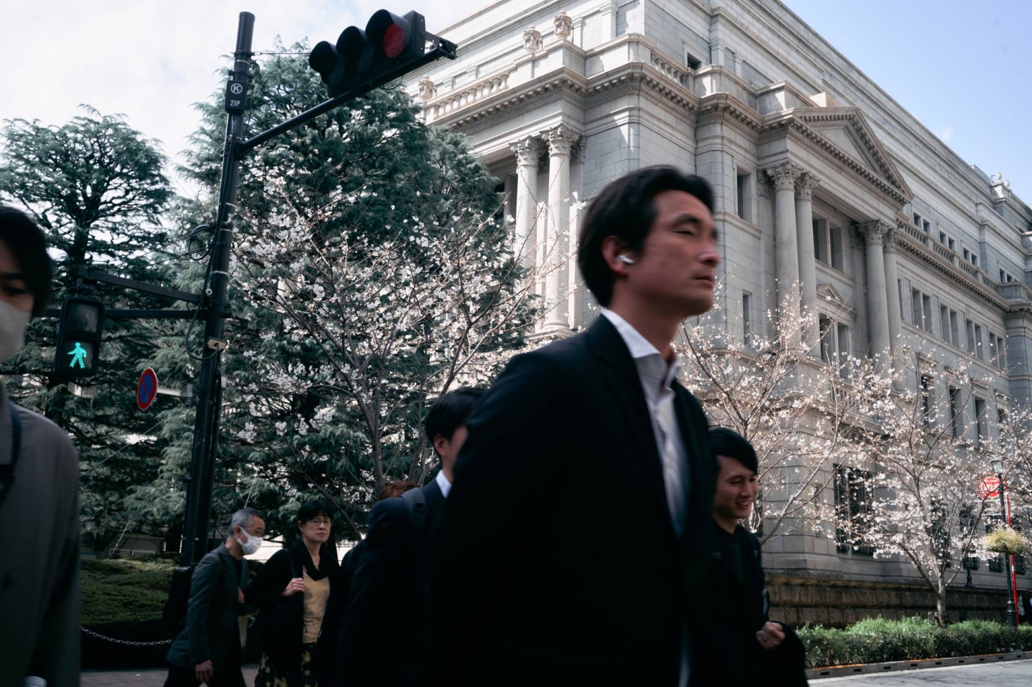 BOJ keeps options open by citing dual risks in regional reports