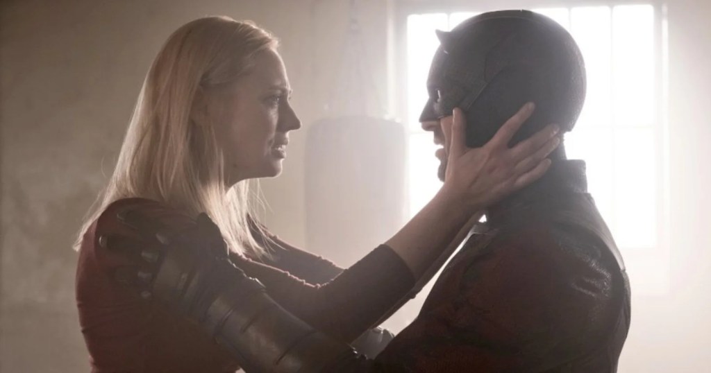 Deborah Ann Woll as Karen Page and Charlie Cox as Daredevil next to each other in Daredevil: Born Again Season 2