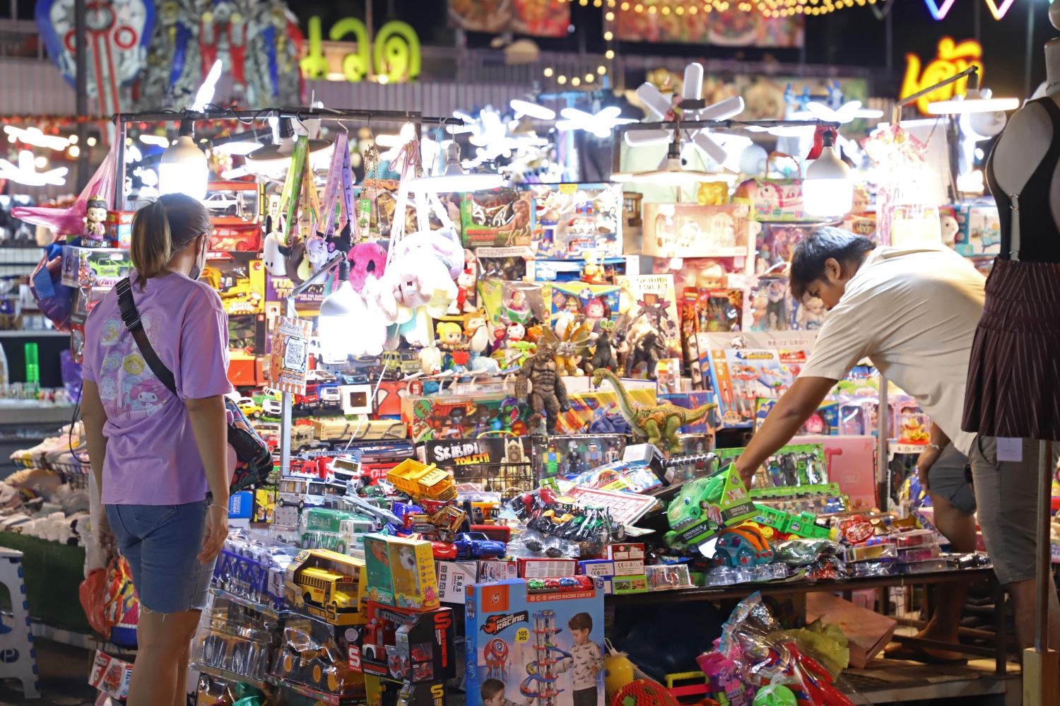 Street markets remain popular among low-income shoppers, who are expected to tighten spending in coming months.  Varuth Hirunyatheb