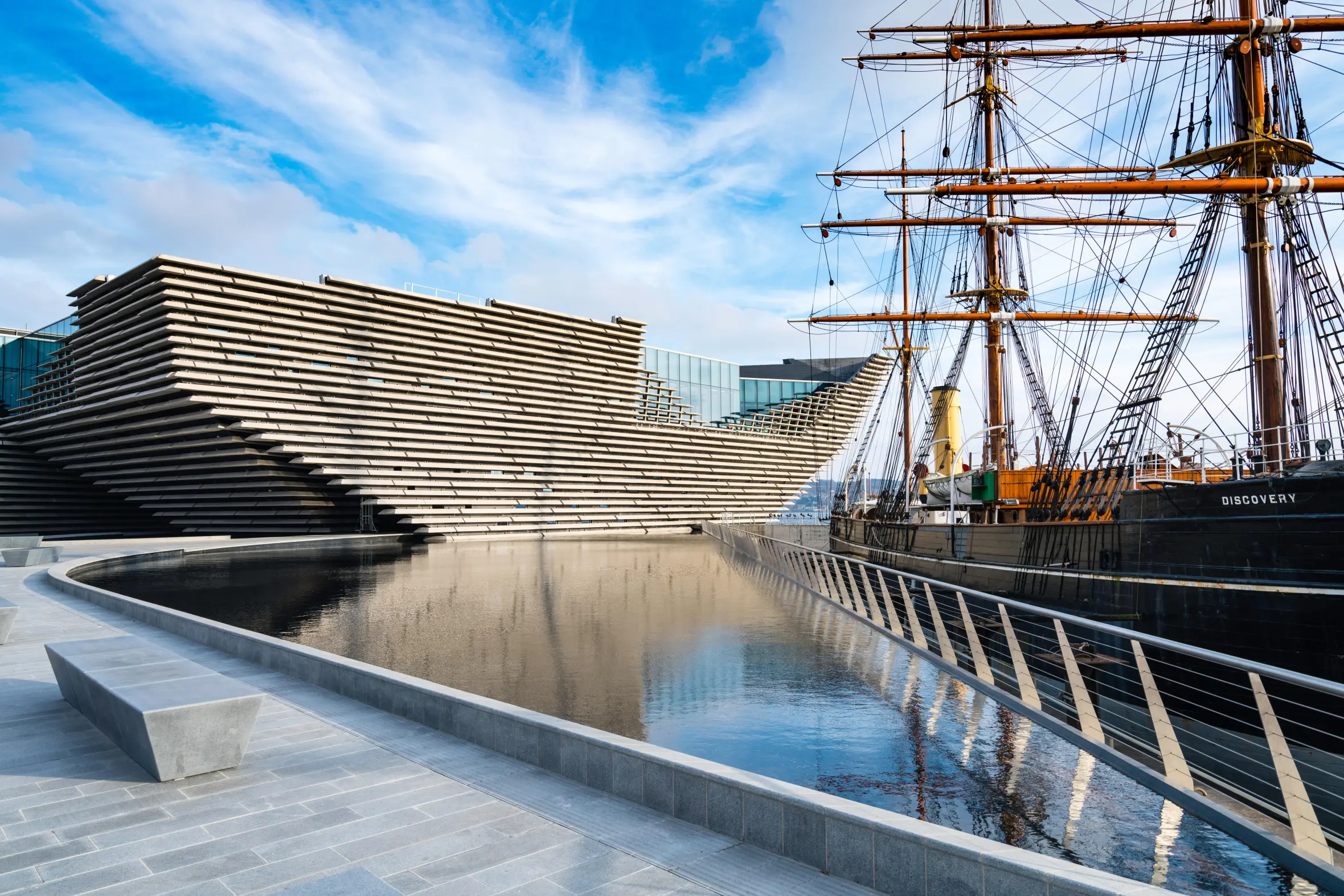 View of the V&A Museum of Design in Dundee, Scotland, next to the RRS Discovery ship.