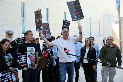 Ruby Chen, father of hostage Itay, speaks outside the Supreme Court in Jerusalem during a demonstration calling for a Oct. 7 state commission of inquiry, Thursday.