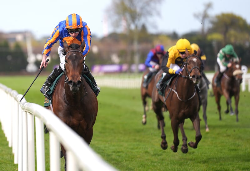 True Love ridden by Ryan Moore (left) on their way to winning the Ballylinch Stud Priory Belle Stake at Leopardstown on Sunday. Photograph: Niall Carson/PA Wire