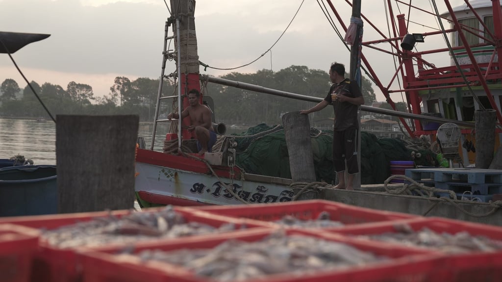 Fishermen at a pier in Chonburi, Thailand. Photo: Aidan Jones