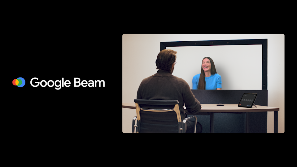 A banner image with the Google Beam logo on the left and a person sitting in front of the Beam screen talking to another person, who appears to pop slightly out of the screen.