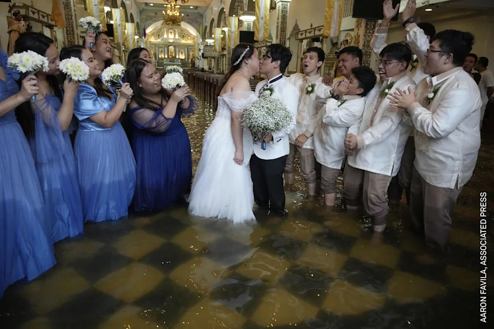 The newlyweds share a kiss as guests cheer. The couple have been together for ten years. According to Verdillo, “This is just one of the struggles that we’ve overcome.”