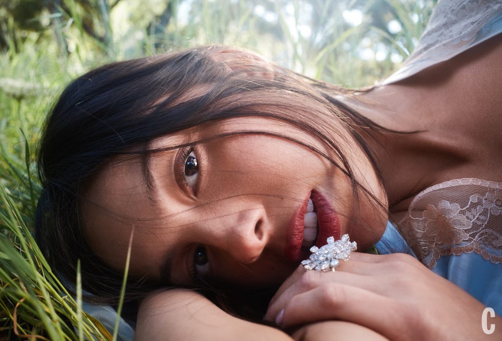 Person resting in grass with partial view of arm and shoulder. Person resting in grass with partial view of arm and shoulder.
