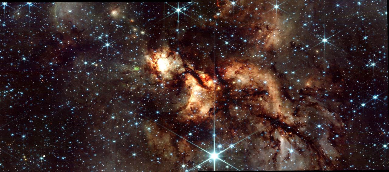 white and gold clouds of gas on a starry background