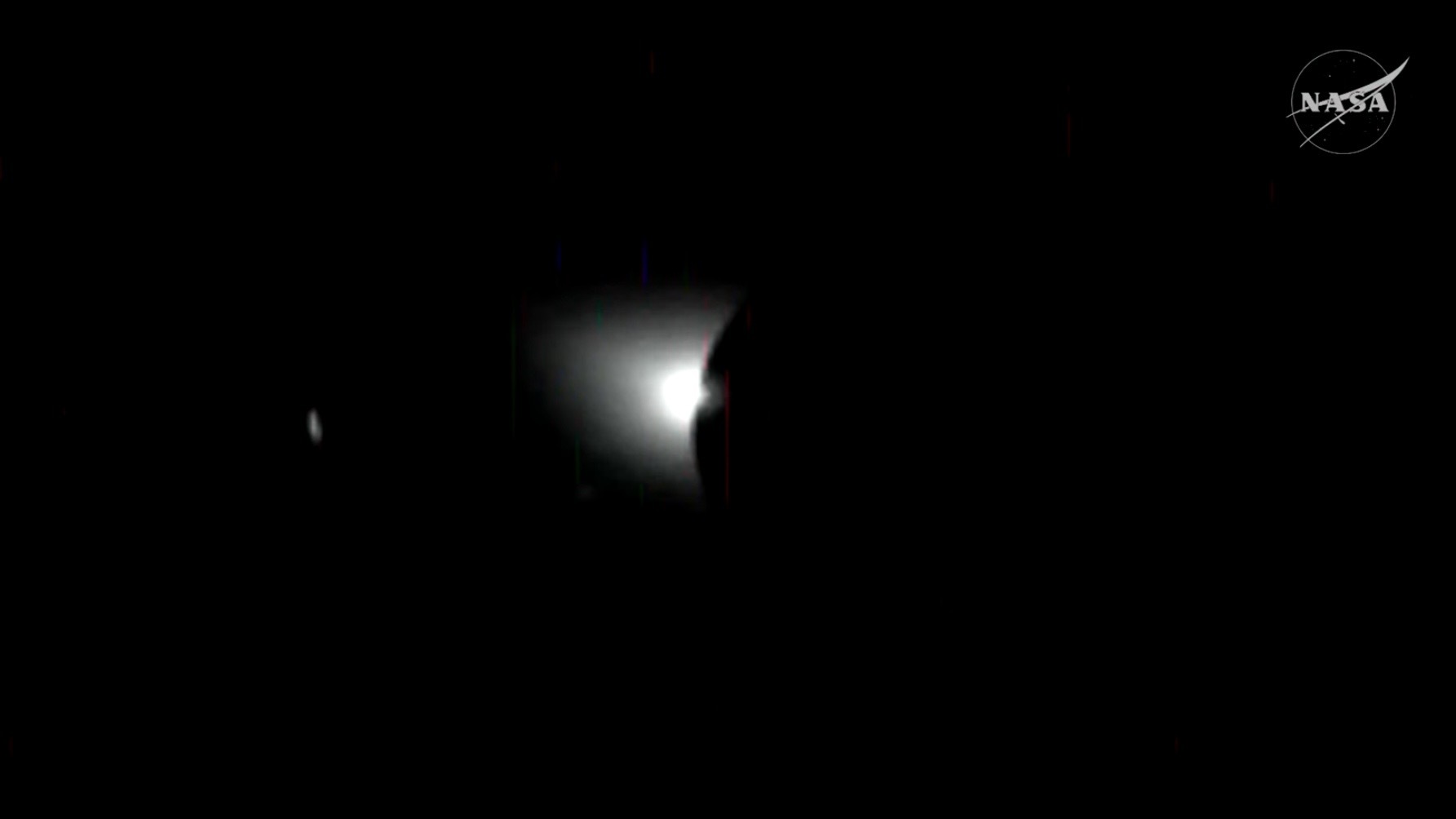 a shimmer of light appears among a screen of black on the bottom right.