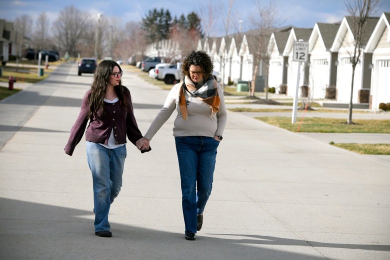 Mom Jennifer Middlin and daughter Eleanor, 20, walk outside their home in Holt, Michigan. 