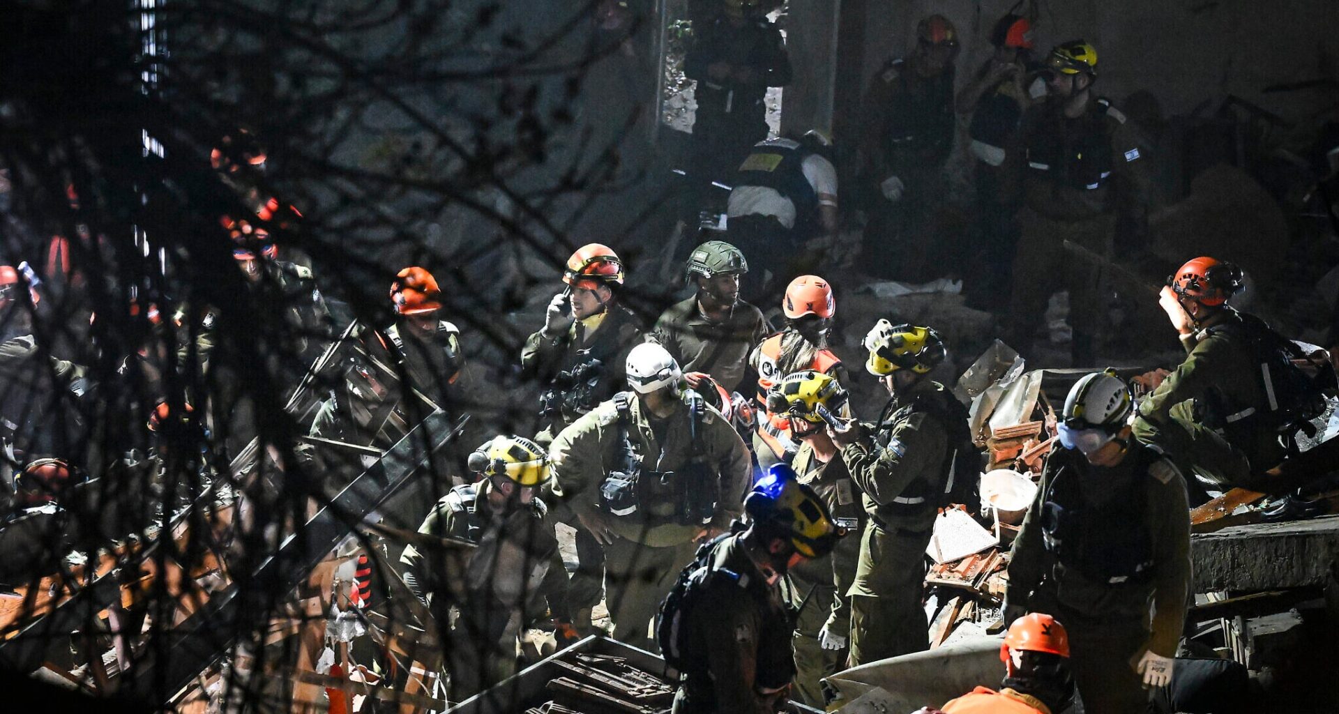 Search presses into night for 4 feared buried under Haifa building struck by missile