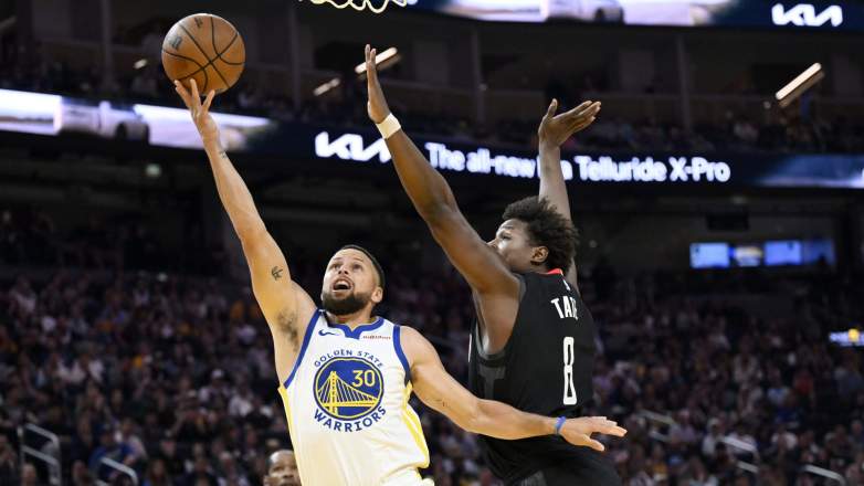 Stephen Curry makes a tough shot in his return after 27-game absence