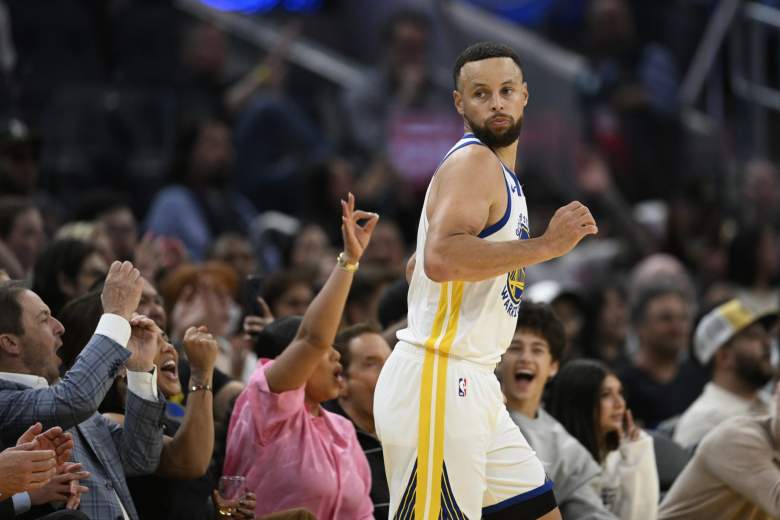 Stephen Curry reacts during Warriors game after returning from 27-game absence with knee injury