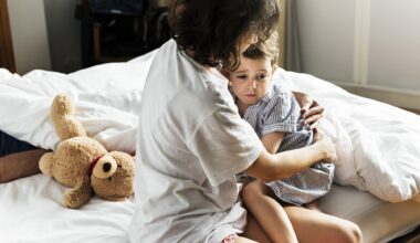 Mother hug and consoling the little boy from nightmare