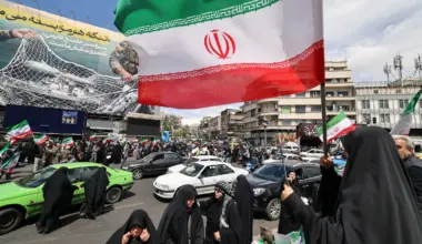 After Trump pauses war, Iranians fly flags of victory not surrender