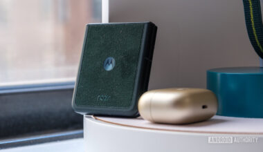 Motorola Razr Ultra in Alcantera next to Moto Loop Buds