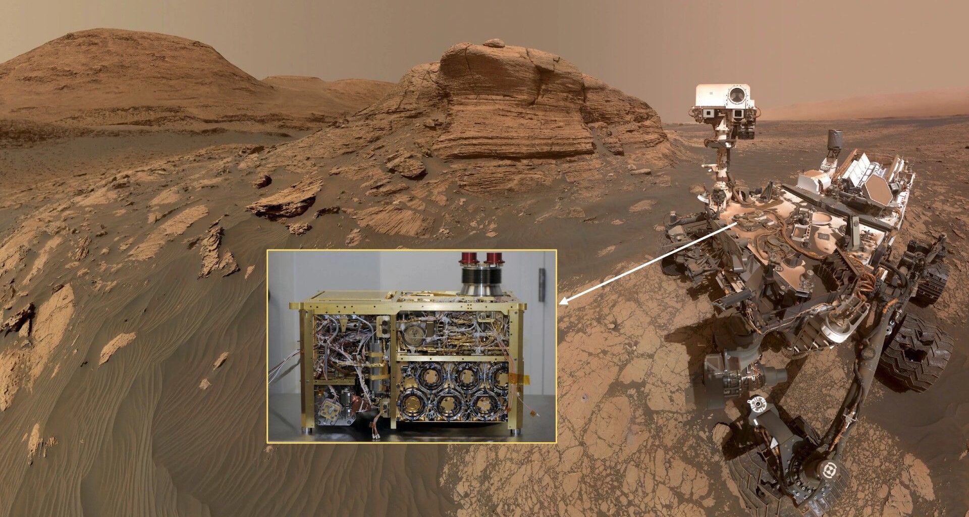 a photograph of a four-wheeled robot on a reddish-orange dusty surface