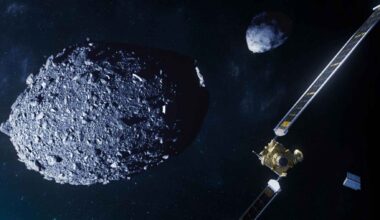 Illustration of NASA’s DART spacecraft approaching the Dimorphos and Didymos asteroid system in space