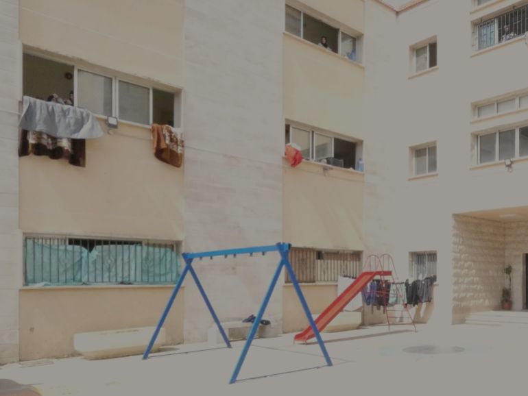 Vacant swings and slides at a school in the Lebanese Mountains.