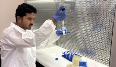 A scientist works with DNA samples in a lab.