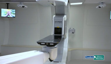 A proton therapy machine labeled HyperScan in a medical treatment room at Froedtert & Medical College of Wisconsin.