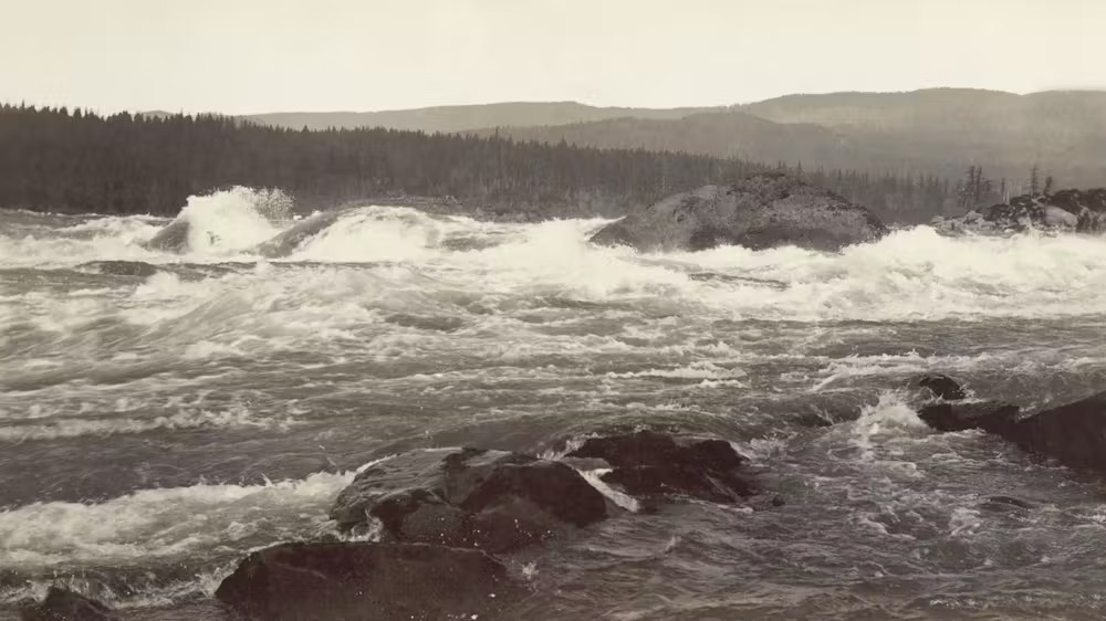 A black and white photo of ocean waves.