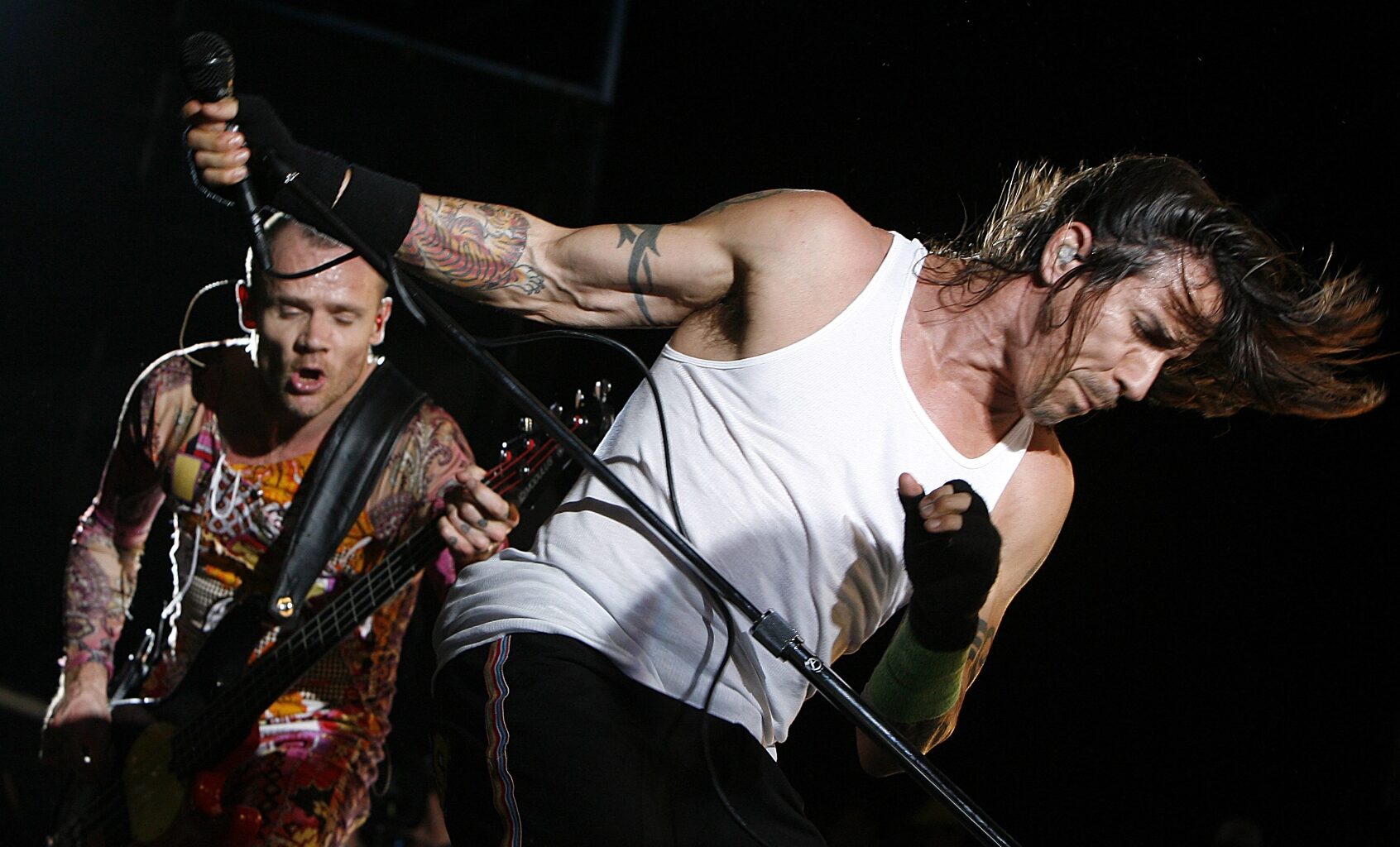 Flea and Anthony Kiedis  perform at Charlotte Motor Speedway in Charlotte, North Carolina in May 20, 2006. (Kevin C. Cox/Getty Images)