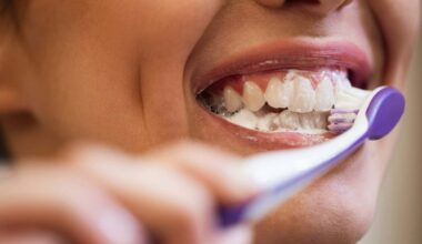 Close-up of woman brushing her teeth.