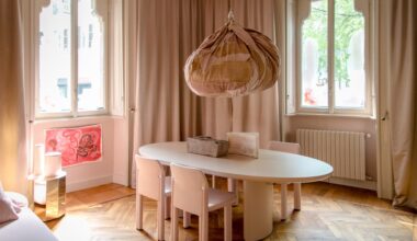 In the main "pink room" she used patchwork offcuts to create a jovial imperfect spherical shape that can be hung from the ceiling. The curation includes Tacchini's new 1809 floor light, the Gianfranco Frattini Grand Sesann sofa and the Torii Love table by Studio Pepe finished in matte powder and pink lacquer.