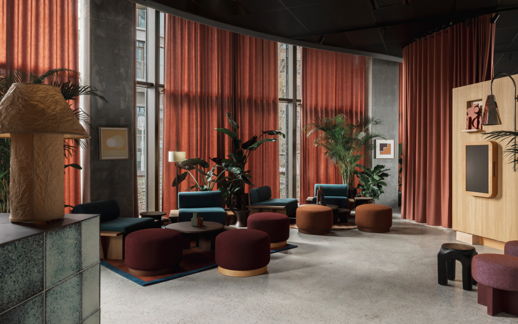 rust and brown seating and curtains in lobby of Locke Copenhagen designed by A-nrd
