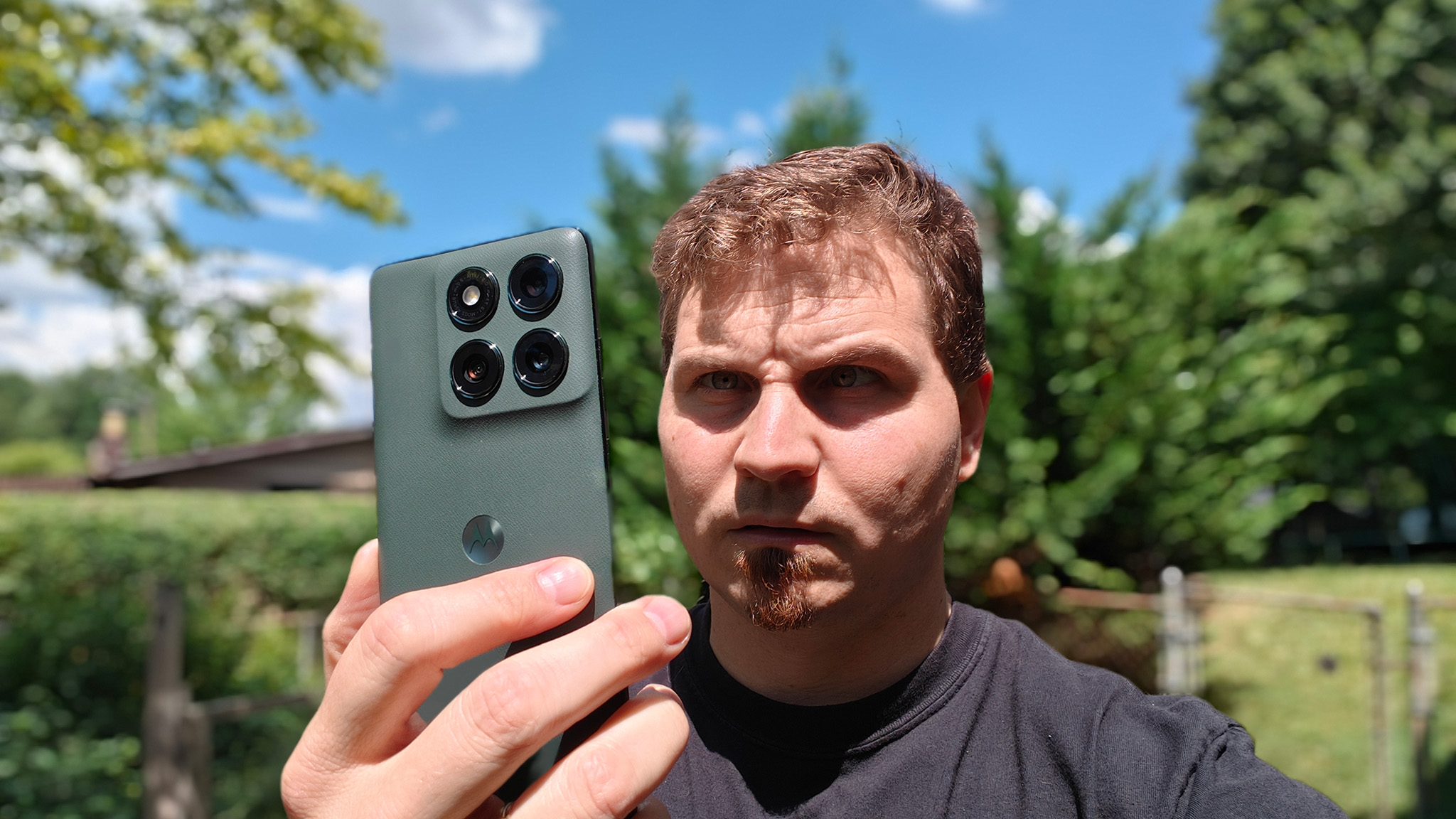 Looking in disbelief at a Motorola Edge 2025