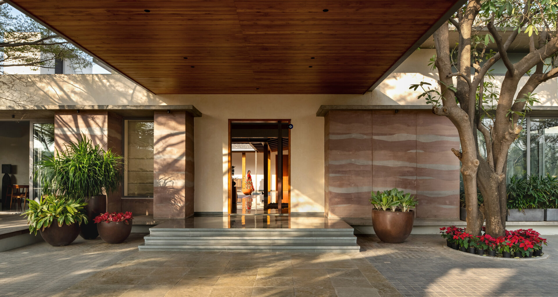 Rammed-earth walls enclose A House Born of Four Soils in India